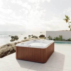 Jacuzzi® J235™ / J235IP™ - 6 Person Hot Tub With 1 Lounger -Outdoor Living Hot Tubs JHT J235 Lifestyle RoastedChestnut Isosquare