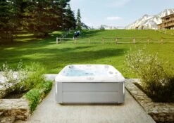 Jacuzzi® J385IP™ - 7 Person Hot Tub -Outdoor Living Hot Tubs JHT J385 Lifestyle BrushedGray V3 2000x1414 cd4d6490 eb8a 4cc8 93ff 7e2768be9789