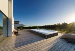 Jacuzzi® PowerActive™ J-19™ - 19ft Swim Spa -Outdoor Living Hot Tubs JSS PowerActive J19 SmokedEbony Lifestyle 3000x2038 cb9e8a05 c738 4e3b b0dc f4ef1599e791